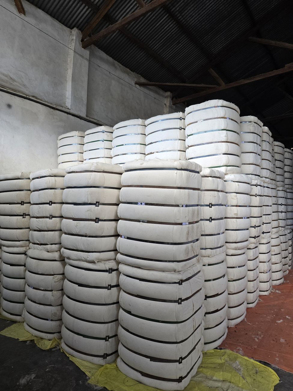 Kapok bales stored in our warehouse, ready to ship