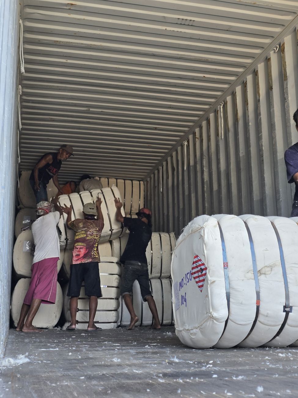 Stuffing the export container by hand