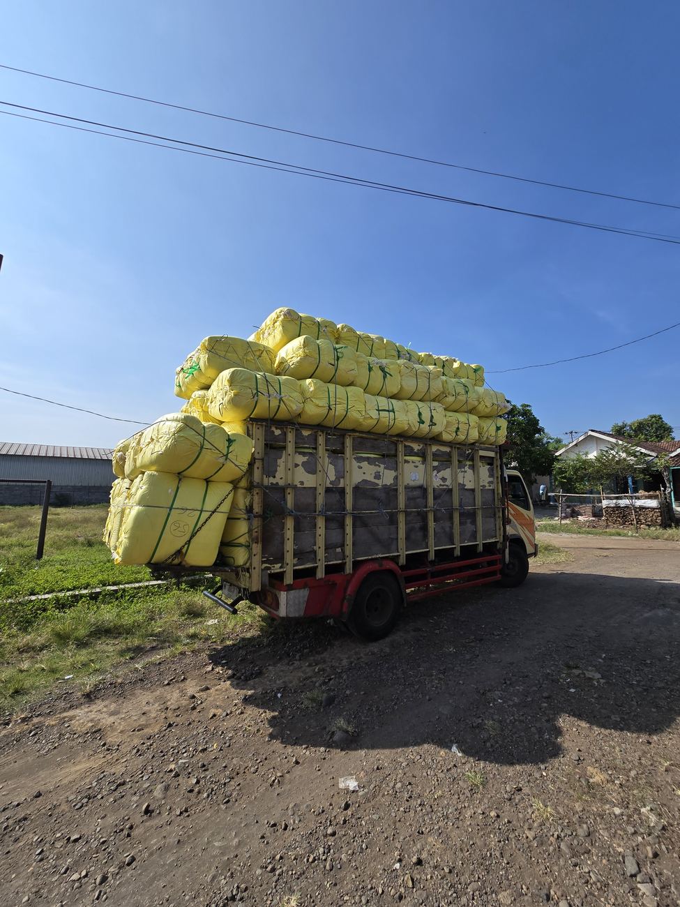 A fully loaded truck leaving for the port