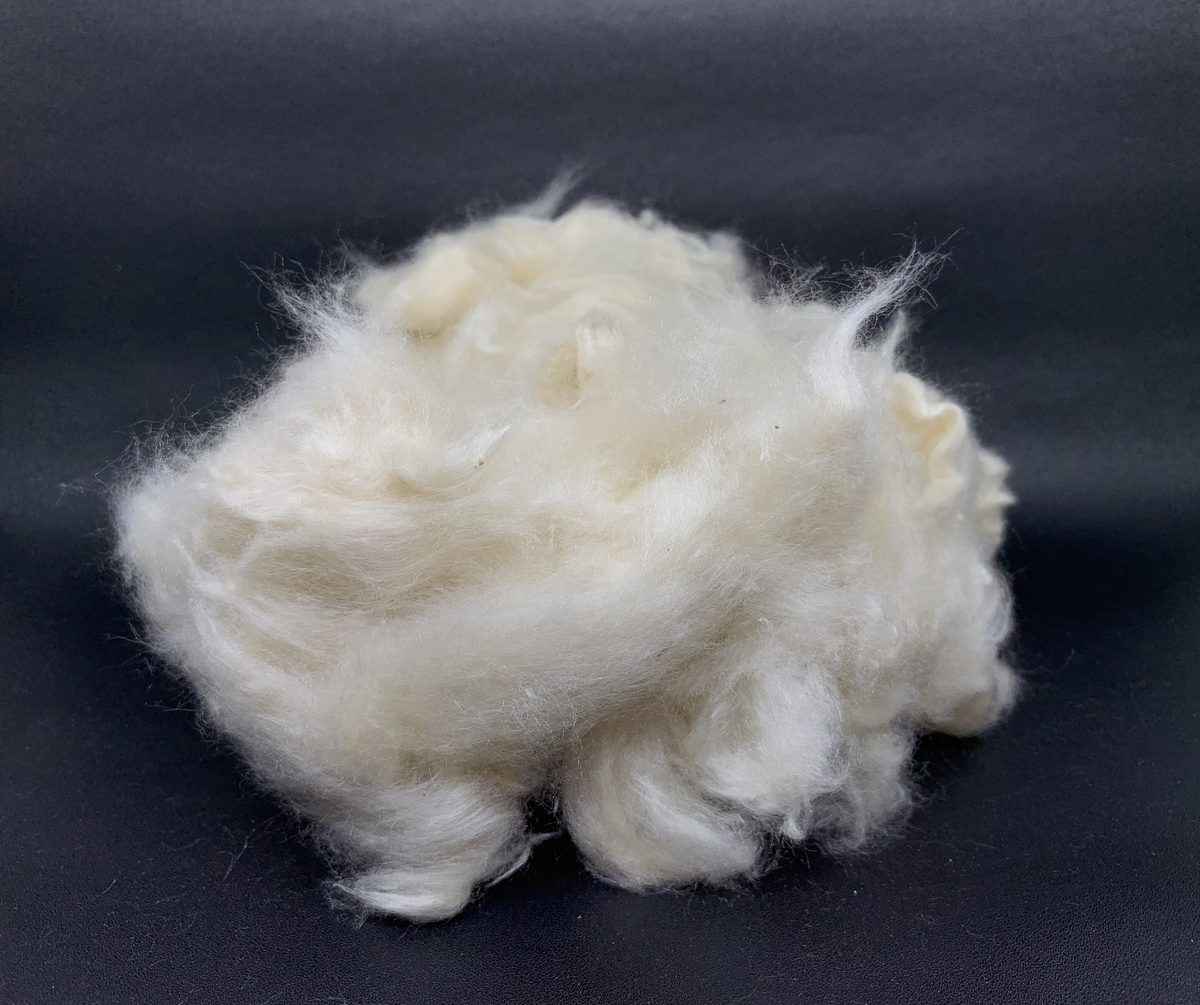 Grade A kapok fiber — clean white floss