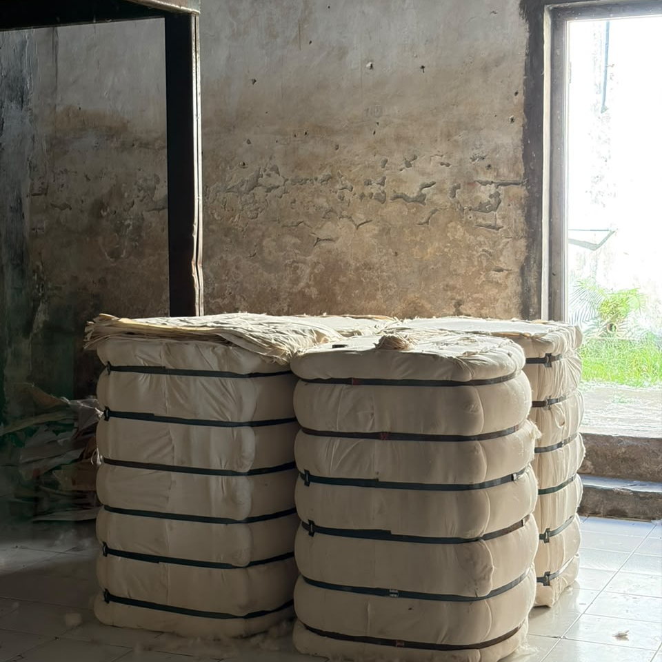100 kg cotton-wrapped kapok bales strapped for export